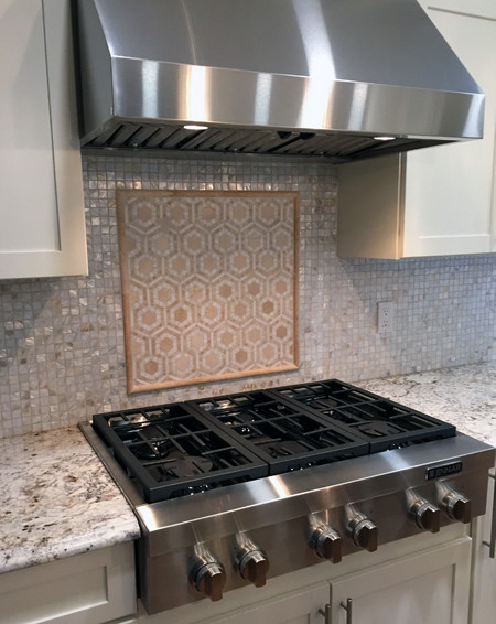 backsplash mosaic stove behind splash counter burner rough textured surface mess handsome practical yes